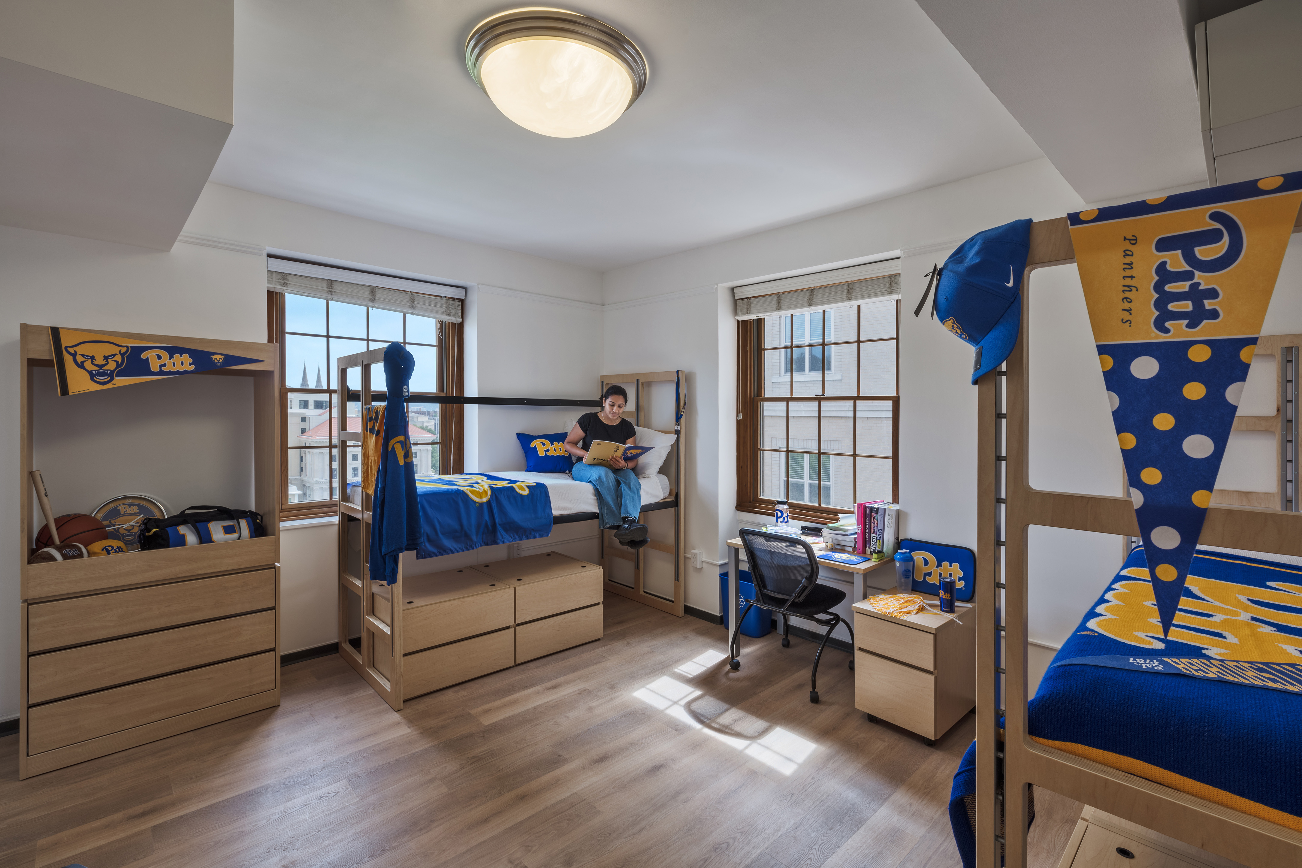 student dorm room decorated with Pitt Panthers merchandise