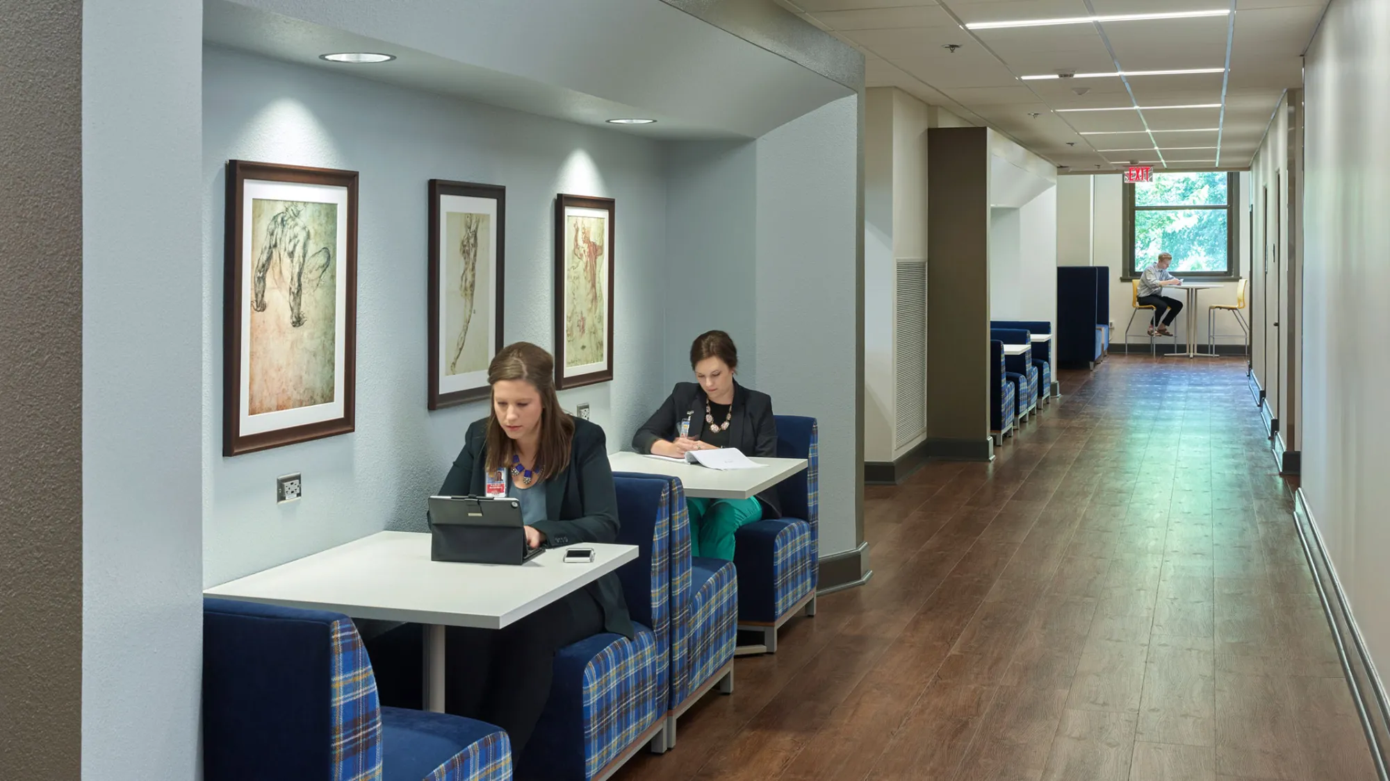 view of medical students working in corridor