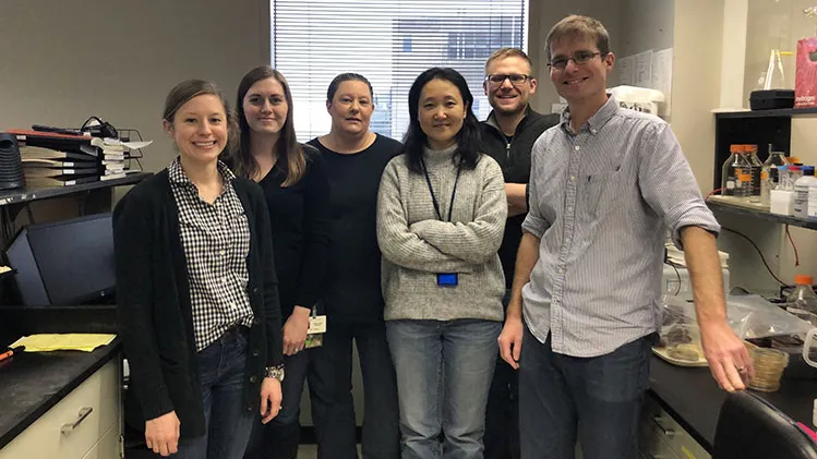 group photo of research team in a lab