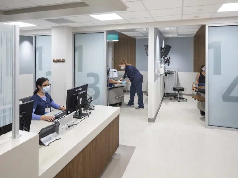 Nurse station with a peek into a couple of blood transfusion patient rooms