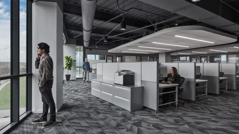Workspace with natural light from floor-to-ceiling window