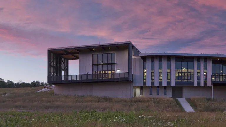 South facade of the Battelle Darby Creek Nature Center at dusk.
