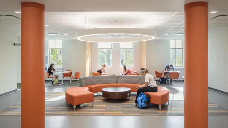 Students studying in the Collaboration room at Moseley Hall