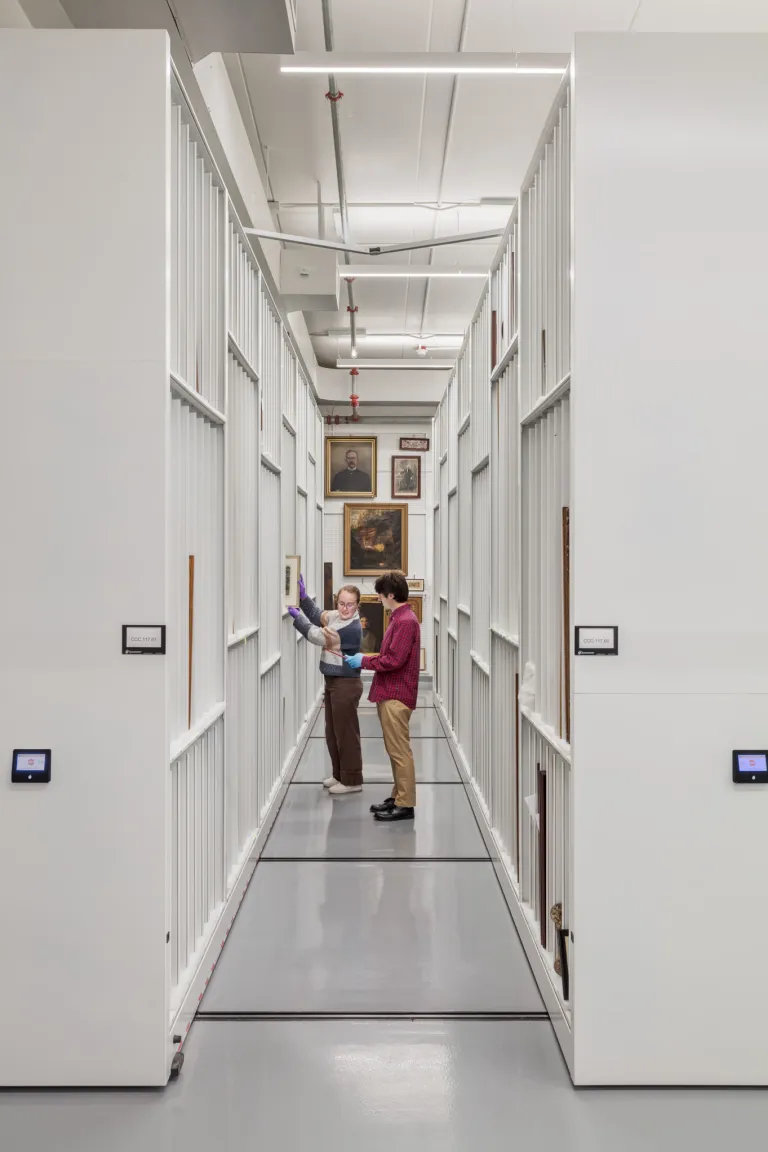 storage shelves containing framed artwork