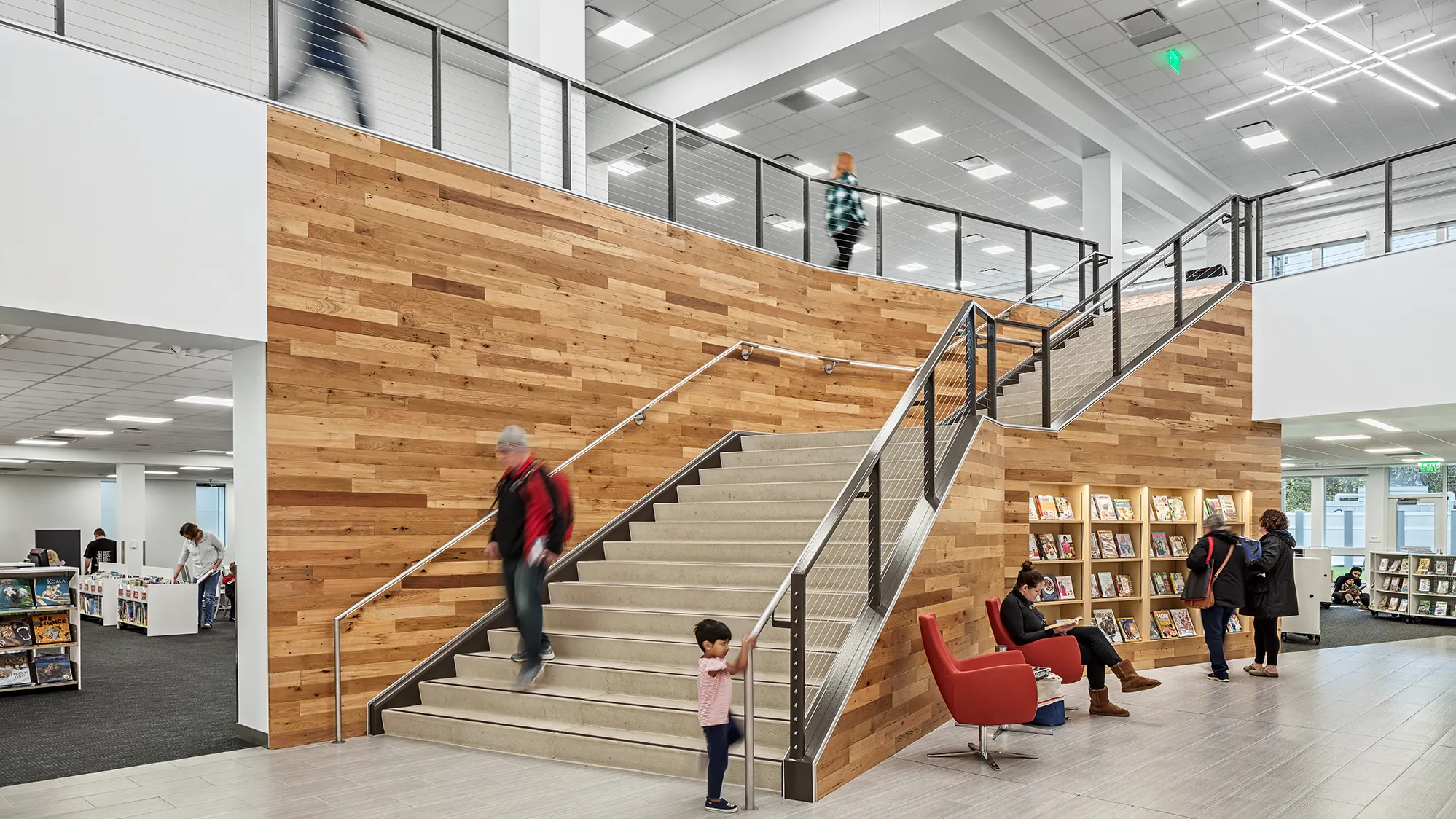 Interior of Hilliard Library featuring stairs with mixed wood paneling