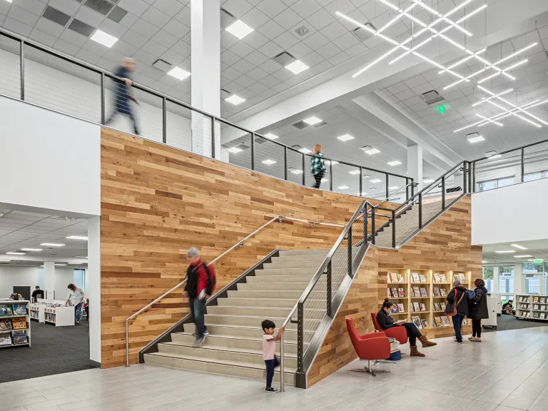 Interior of Hilliard Library featuring stairs with mixed wood paneling