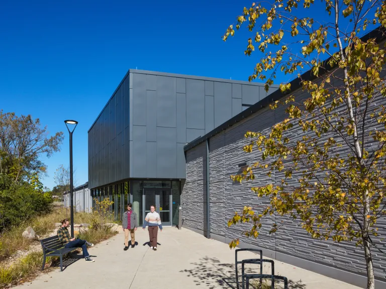 building with stone and metal panel facade