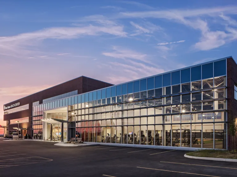 Exterior of Mary Rutan Hospital health center at dusk