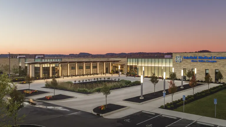 Exterior of River Valley Campus at dusk with exterior lights on