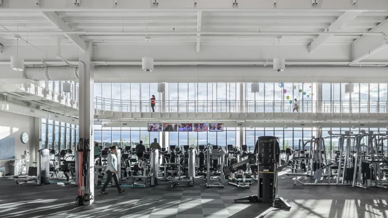 Interior view of the brightly and naturally lit gym area of the Fairfield Medical Center YMCA.