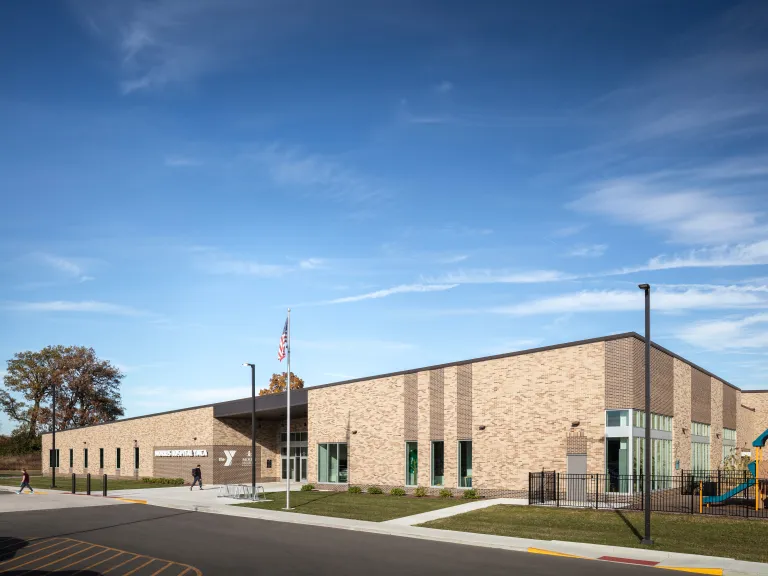 building with brick facade and playground