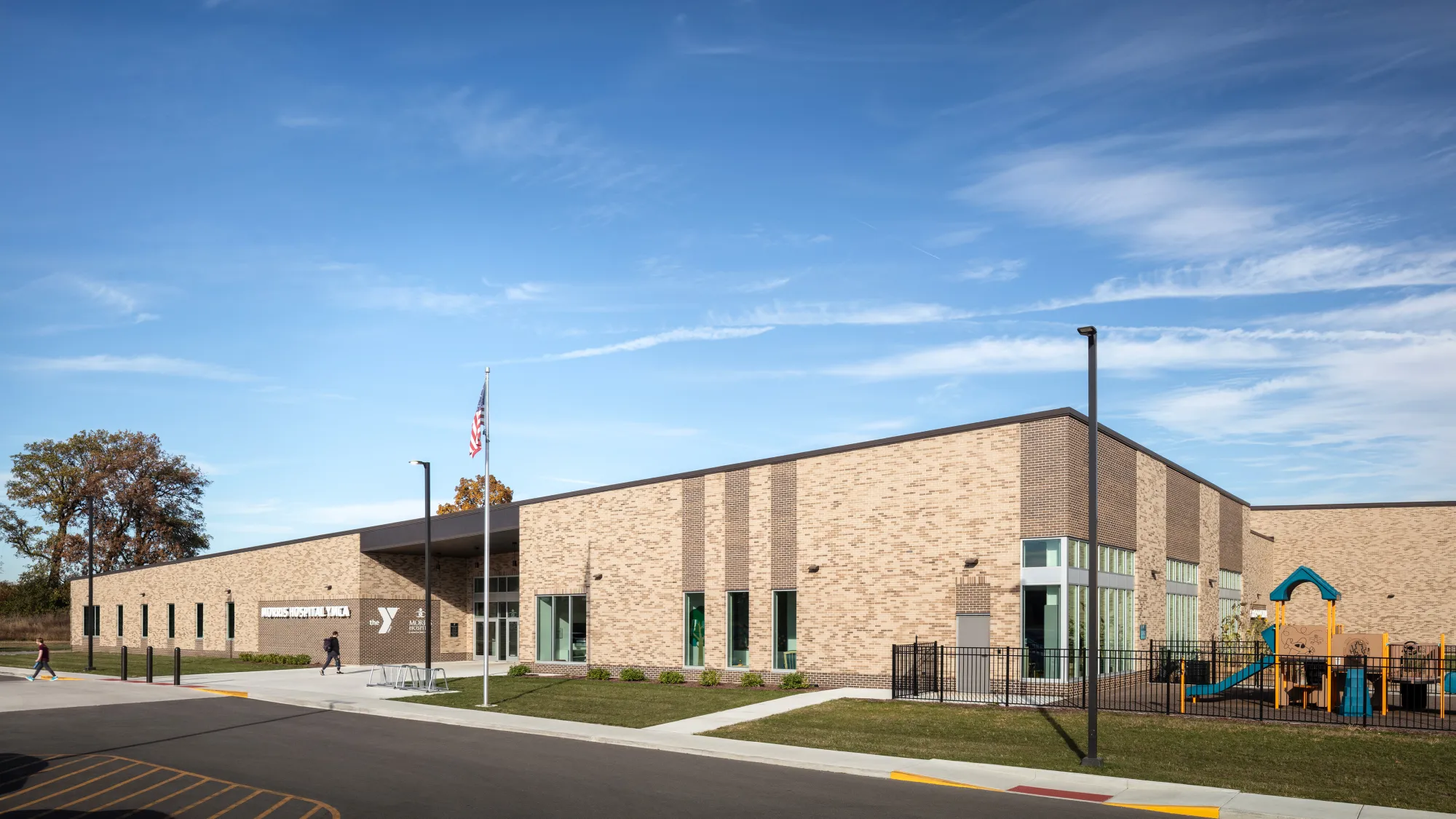 building with brick facade and playground