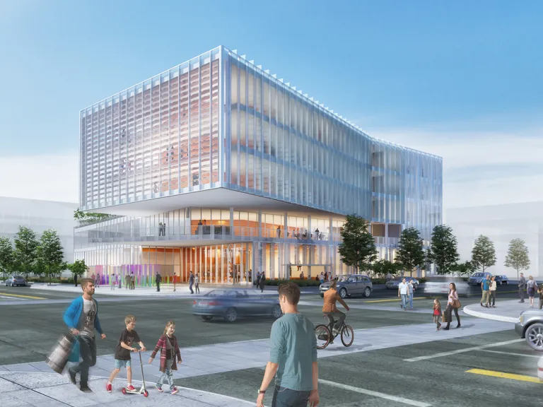 Exterior view of a research facility on the corner of a busy intersection.