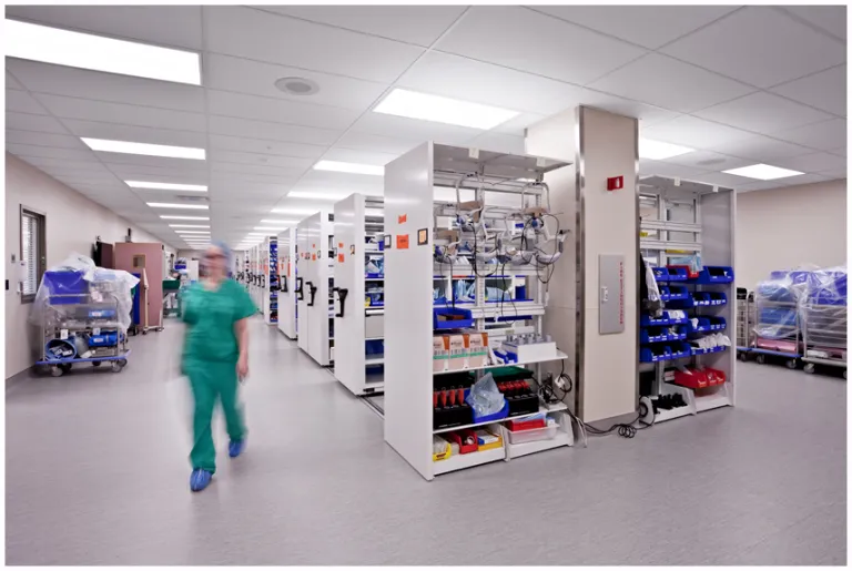Girl walking by shelves