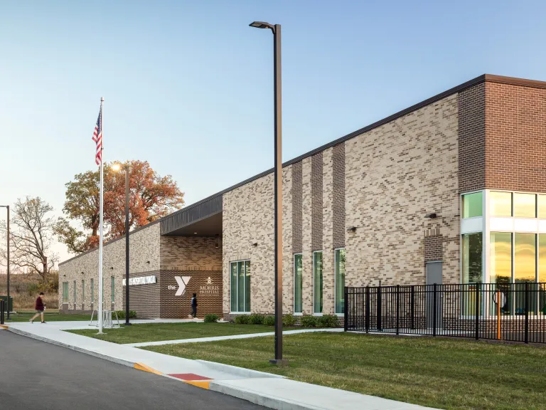 tan brick building at sunset