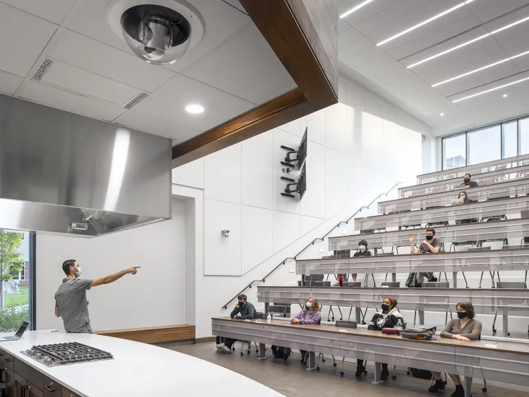 Students in a lecture hall during a class in Mitchell Hall.