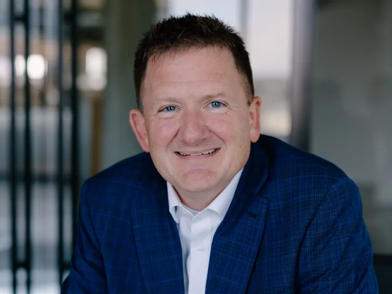 man with plaid navy jacket